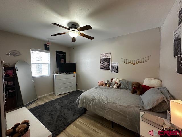 18469 Rd South Cortez, CO 81321 - Photo 17 of 34 a bedroom with a large bed and a window