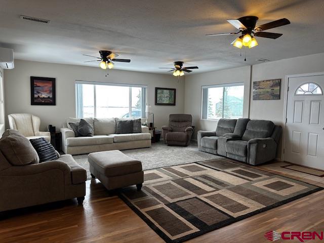 18469 Rd South Cortez, CO 81321 - Photo 23 of 34 a living room with furniture and a chandelier