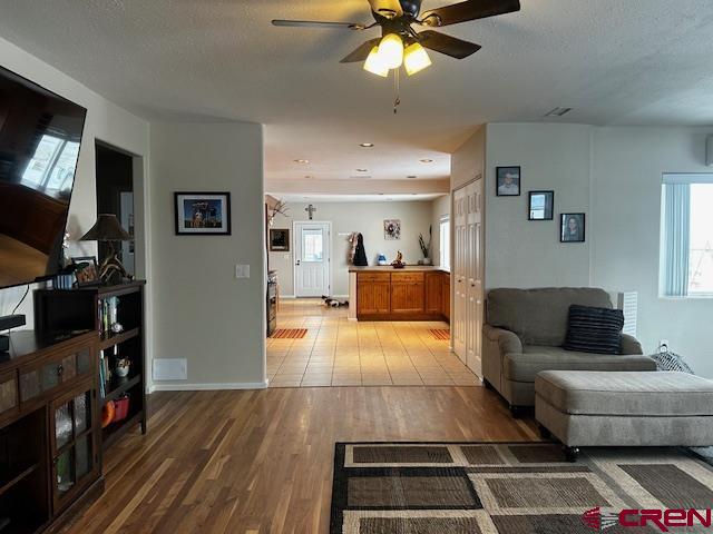 18469 Rd South Cortez, CO 81321 - Photo 24 of 34 a living room with furniture and a flat screen tv