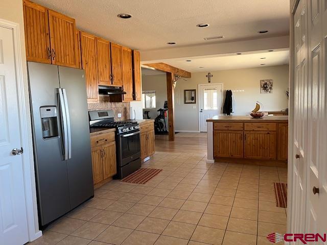 18469 Rd South Cortez, CO 81321 - Photo 5 of 34 a kitchen with stainless steel appliances a refrigerator sink and cabinets
