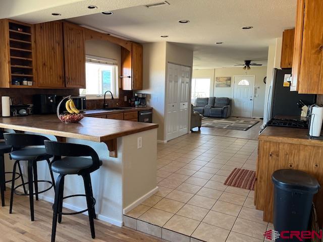 18469 Rd South Cortez, CO 81321 - Photo 8 of 34 a kitchen with stainless steel appliances granite countertop a sink a stove and a refrigerator