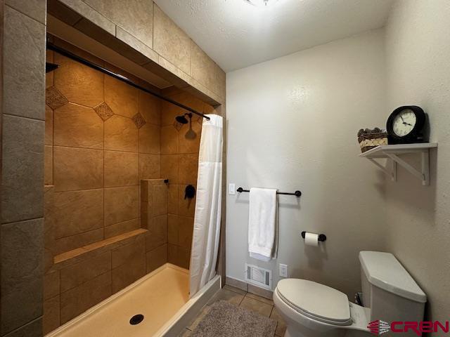 18469 Rd South Cortez, CO 81321 - Photo 10 of 34 a bathroom with a toilet and a shower
