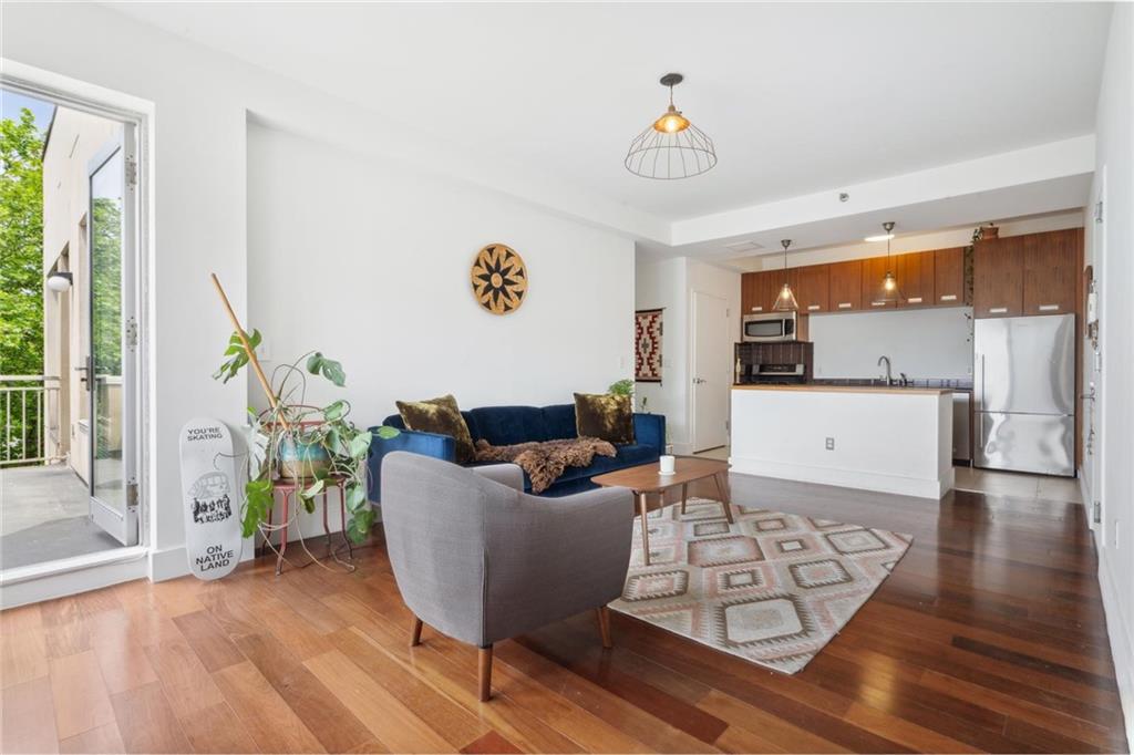 355 Stratford Road, Unit 5C Brooklyn, NY 11218 - Photo 3 of 12 a living room with furniture and a large window