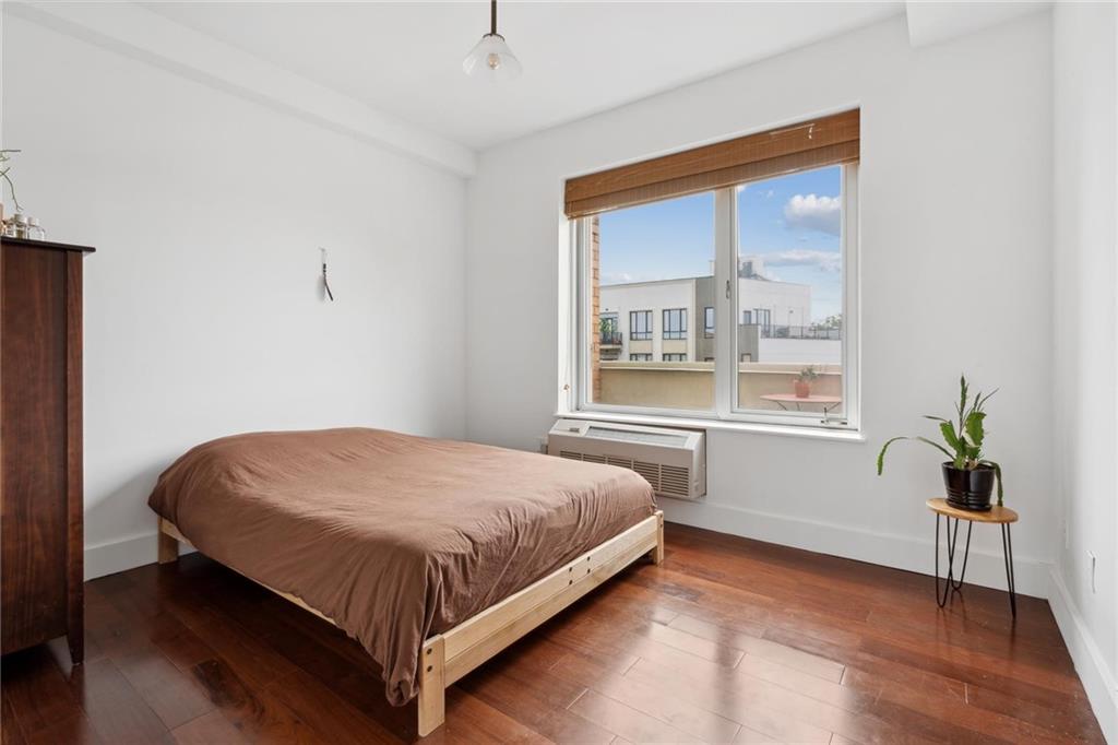 355 Stratford Road, Unit 5C Brooklyn, NY 11218 - Photo 6 of 12 a bed sitting in a bedroom next to a window