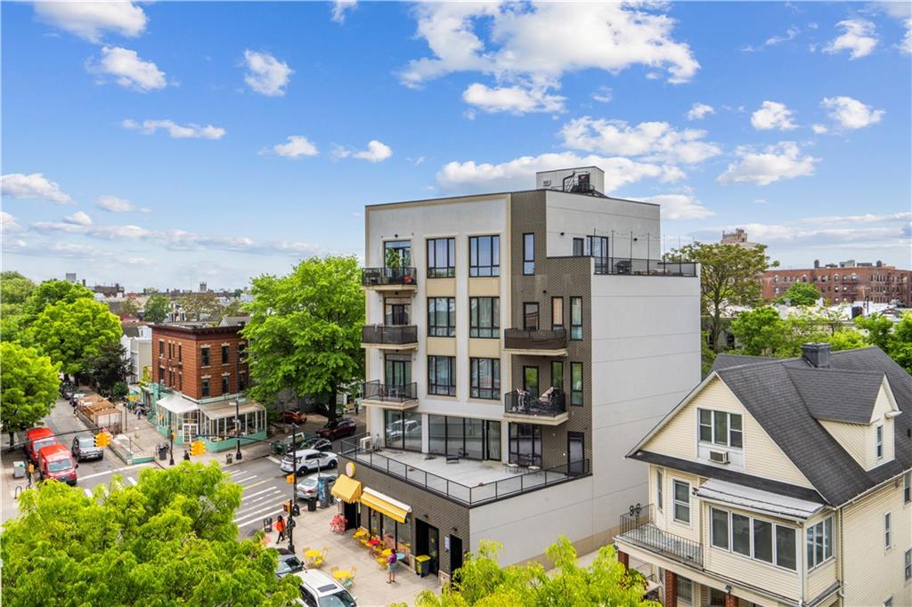 355 Stratford Road, Unit 5C Brooklyn, NY 11218 - Photo 9 of 12 a view of multiple houses with a yard