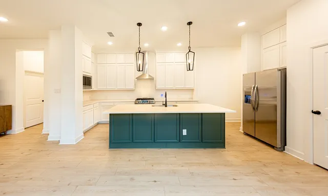 a bathroom with a sink double vanity and a shower