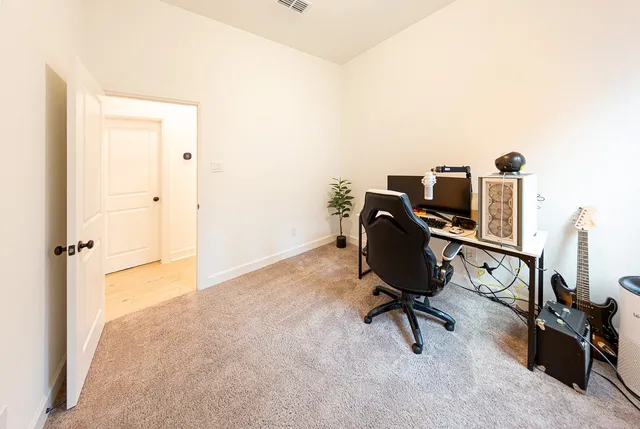 a view of a workspace with furniture