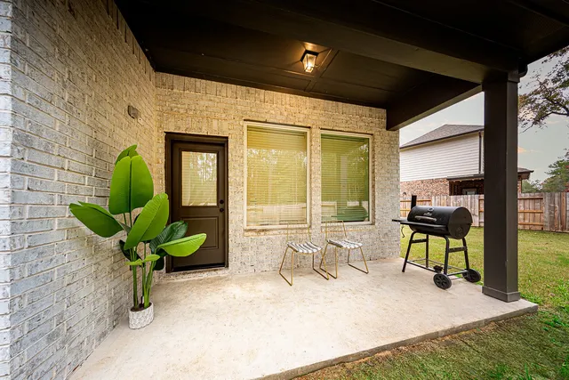 a living room filled with furniture windows