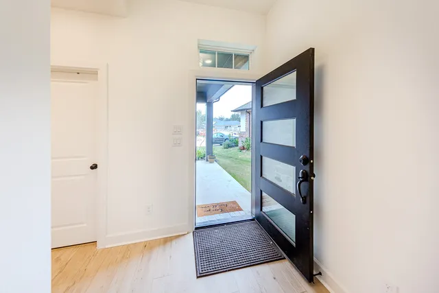 a view of staircase with wooden floor and stairs