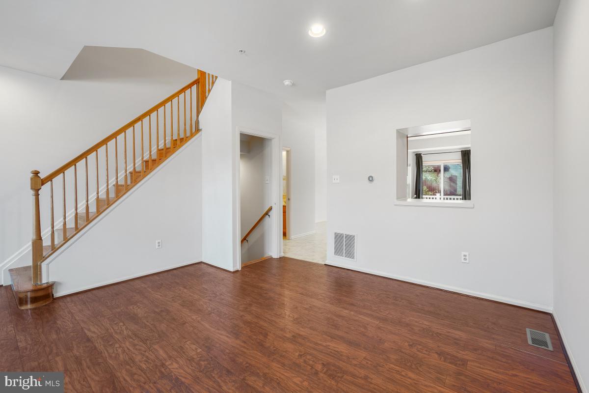 6334 Wind Rider Way Columbia, MD 21045 - Photo 17 of 45 a view of an entryway with wooden floor