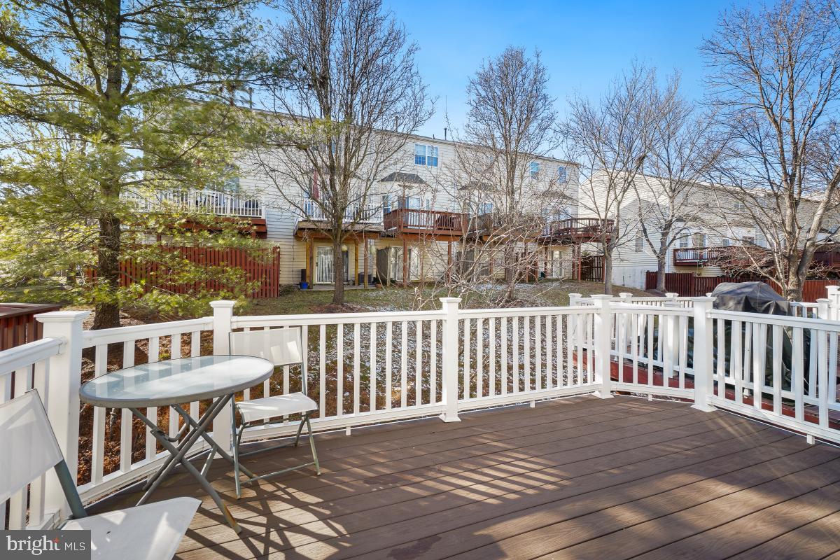 6334 Wind Rider Way Columbia, MD 21045 - Photo 30 of 45 a view of a deck with furniture and trees