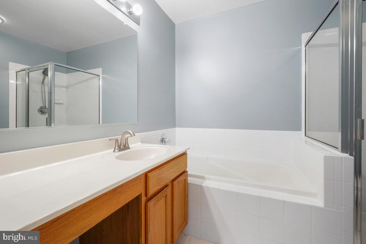 6334 Wind Rider Way Columbia, MD 21045 - Photo 36 of 45 a bathroom with a bathtub and a sink