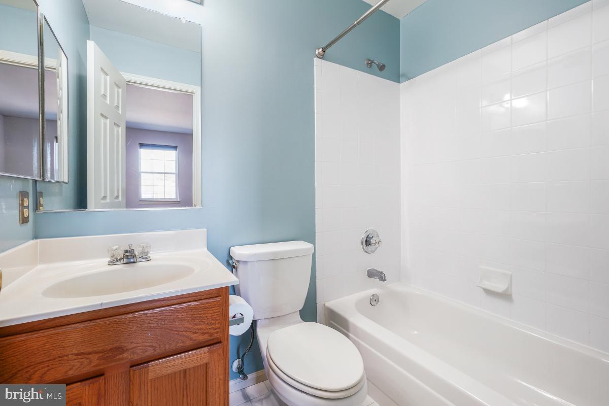 6334 Wind Rider Way Columbia, MD 21045 - Photo 41 of 45 a bathroom with a sink toilet and shower