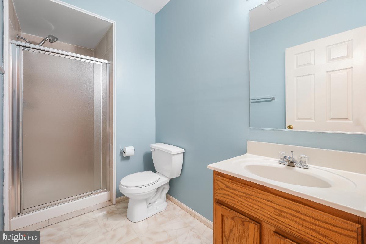 6334 Wind Rider Way Columbia, MD 21045 - Photo 5 of 45 a bathroom with a sink a toilet and shower