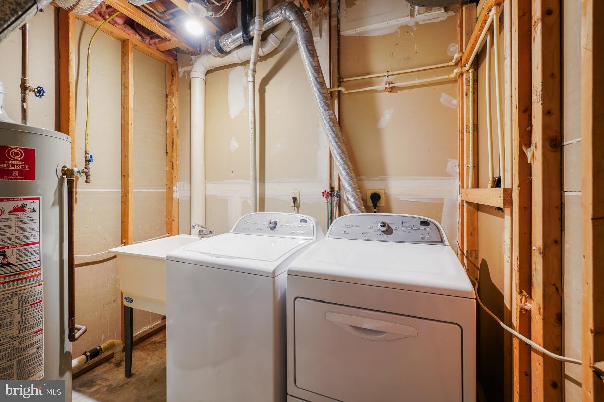 6334 Wind Rider Way Columbia, MD 21045 - Photo 8 of 45 a utility room with dryer and washer