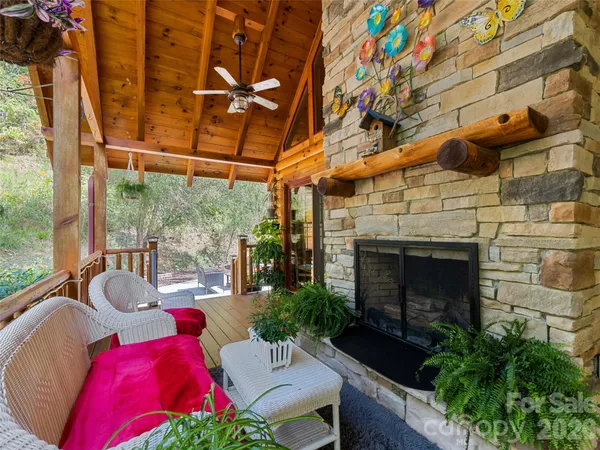 a building outdoor space with patio furniture and potted plants