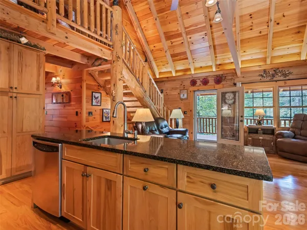 a kitchen with sink and cabinets