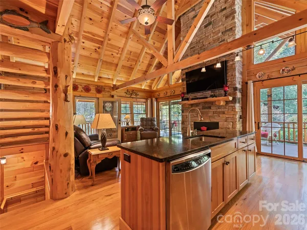 a kitchen with stainless steel appliances granite countertop a stove and a wooden cabinets