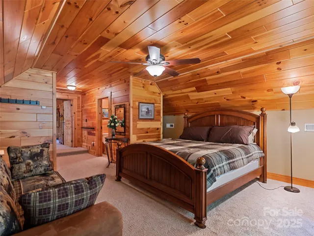 a bed room with a bed and a chandelier