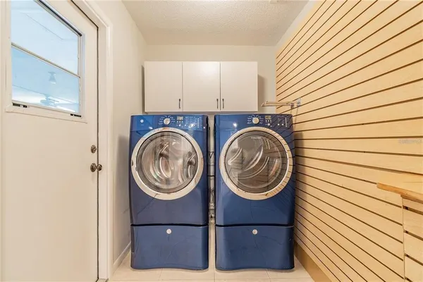 a large kitchen with stainless steel appliances granite countertop a stove and a refrigerator