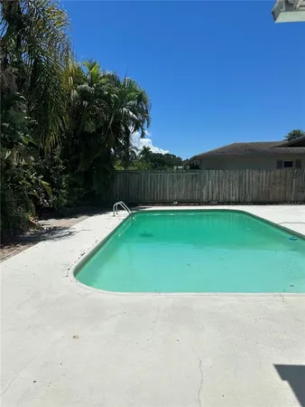 a view of a house with swimming pool