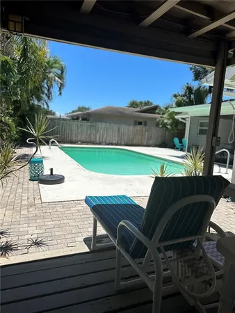 a view of balcony with wooden floor and outdoor seating