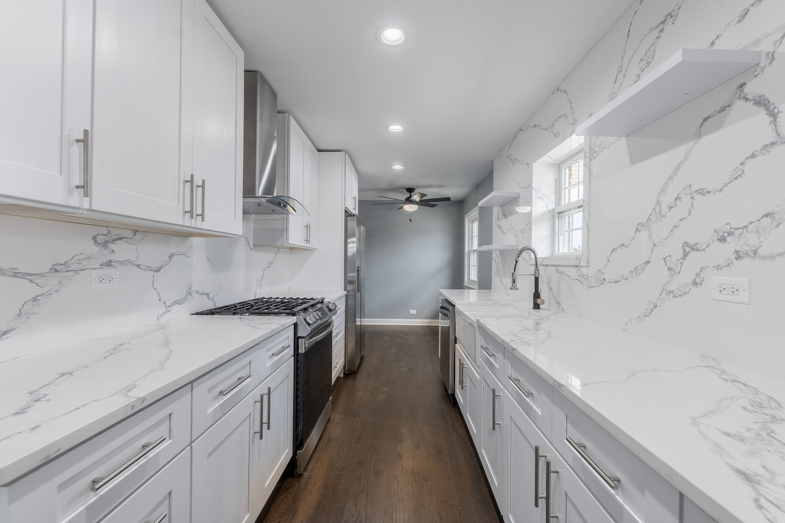 8000 Country Club Lane North Riverside, IL 60546 - Photo 12 of 41 a large white kitchen with granite countertop a sink