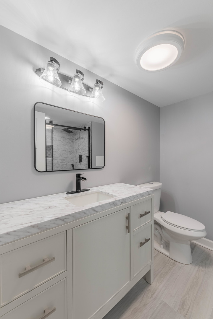 8000 Country Club Lane North Riverside, IL 60546 - Photo 30 of 41 a bathroom with a toilet sink and mirror