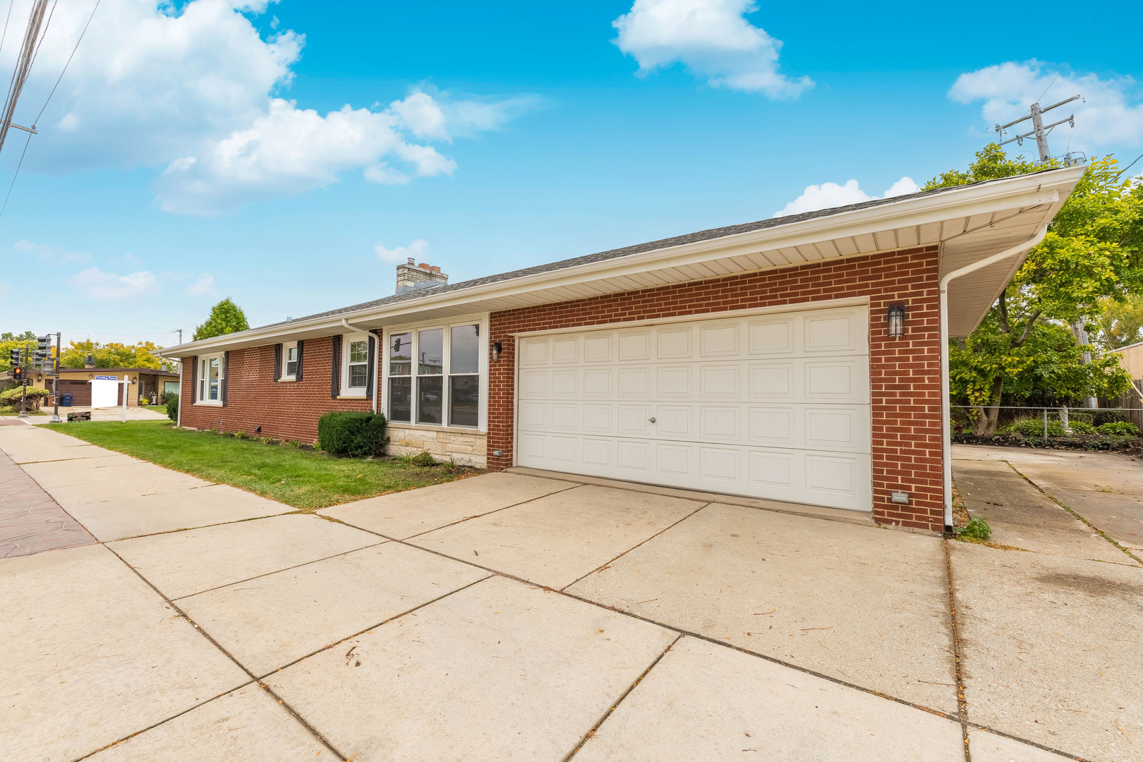 8000 Country Club Lane North Riverside, IL 60546 - Photo 5 of 41 a front view of a house with a yard and garage
