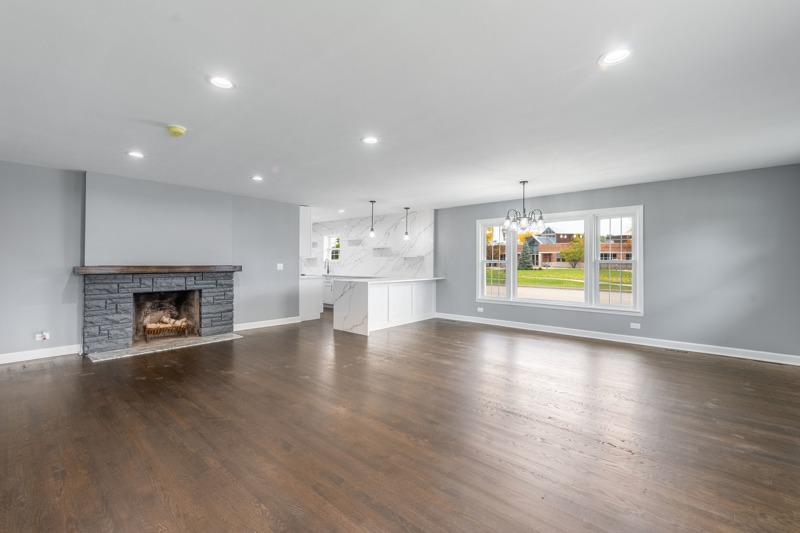 8000 Country Club Lane North Riverside, IL 60546 - Photo 6 of 41 an empty room with wooden floor and fireplace