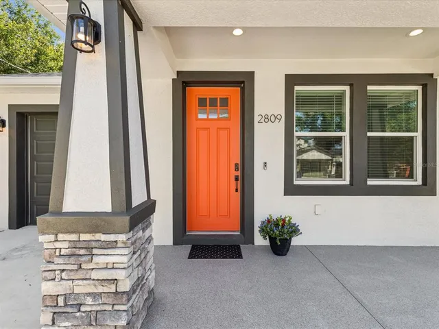 a view of an entryway with wooden door