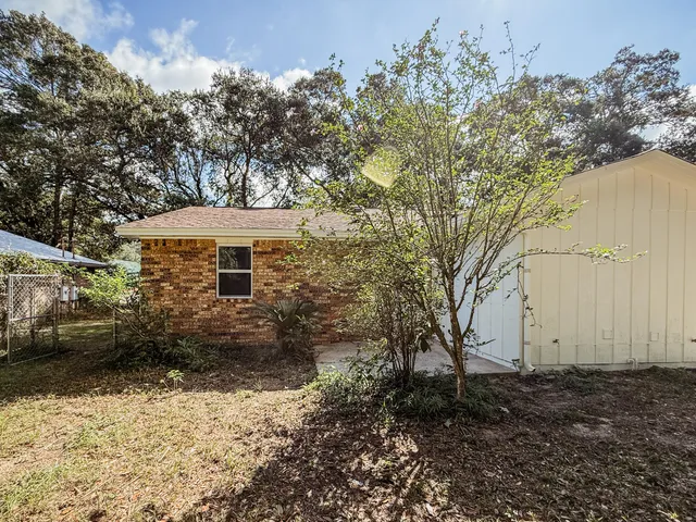 a backyard of a house with lots of green space