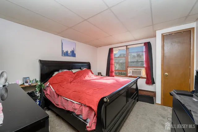 a view of a kitchen with fridge and workspace