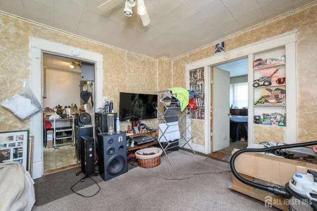 a bed room with furniture and a balcony