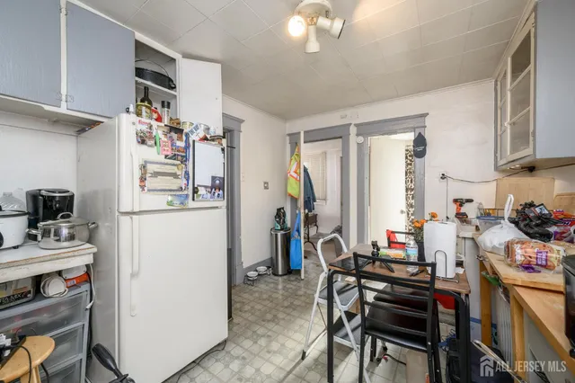 a bed room with a bed and a dresser