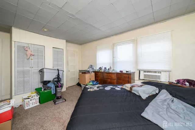 a view of backyard with swimming pool and green space