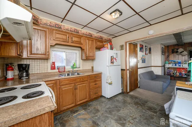 a bed room with a bed and a television