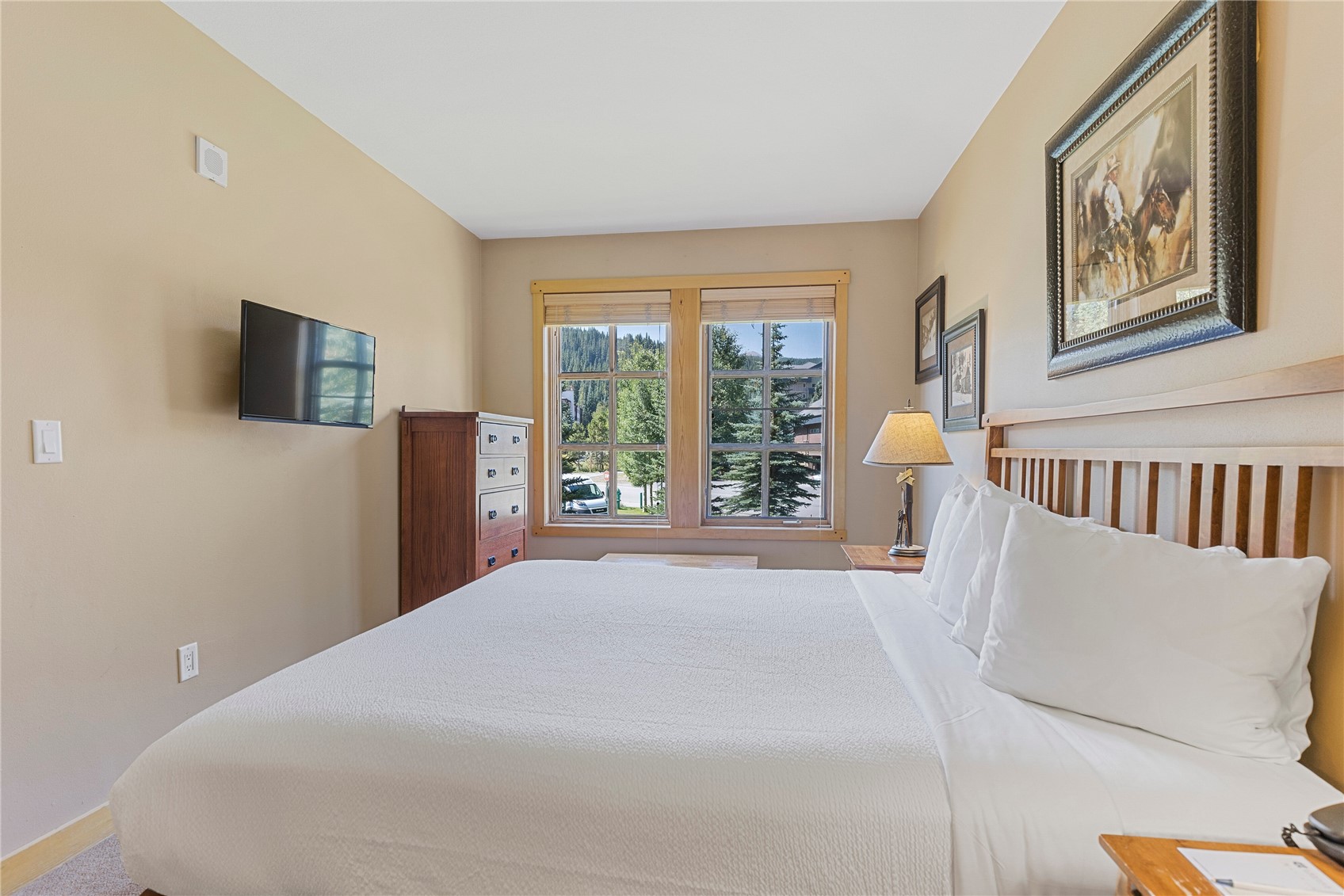 910 Copper Road, Unit 219 Copper Mountain, CO 80443 - Photo 12 of 35 a bedroom with a bed and a large window