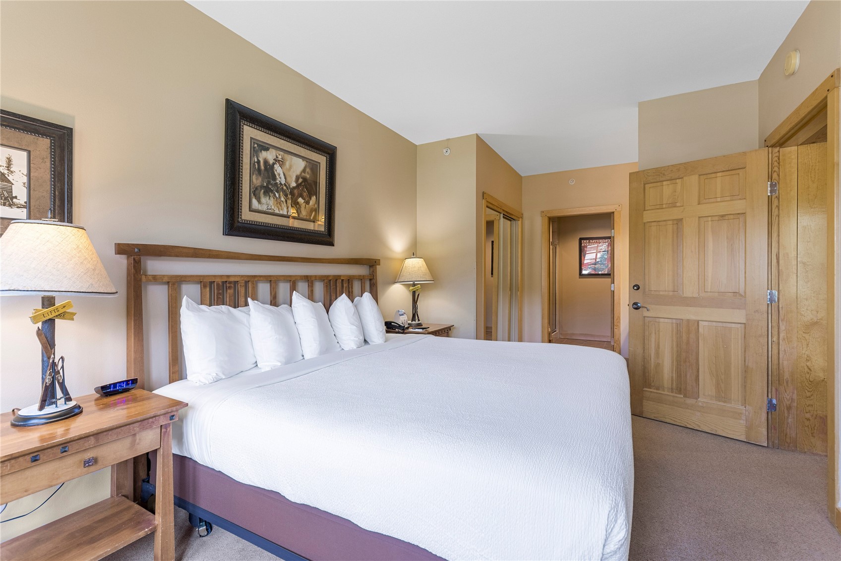 910 Copper Road, Unit 219 Copper Mountain, CO 80443 - Photo 13 of 35 a bedroom with a bed and a lamp on table