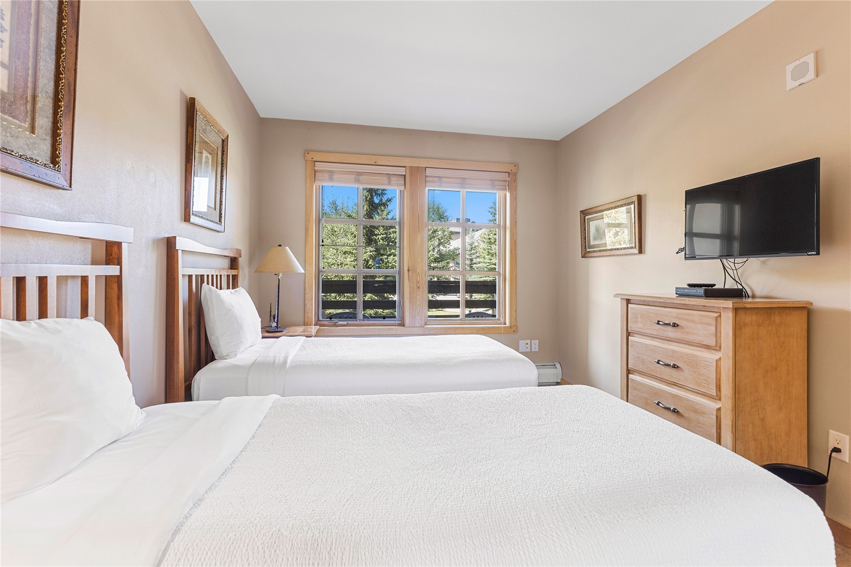 910 Copper Road, Unit 219 Copper Mountain, CO 80443 - Photo 19 of 35 a bedroom with a bed and a flat screen tv