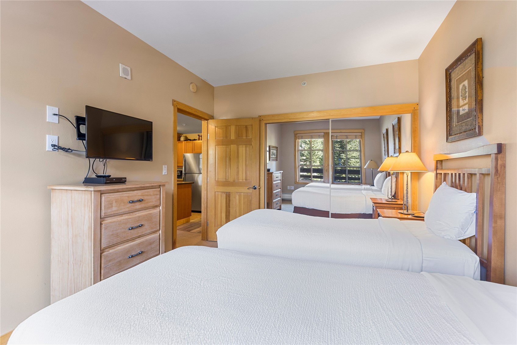 910 Copper Road, Unit 219 Copper Mountain, CO 80443 - Photo 21 of 35 a bedroom with a bed and a flat screen tv