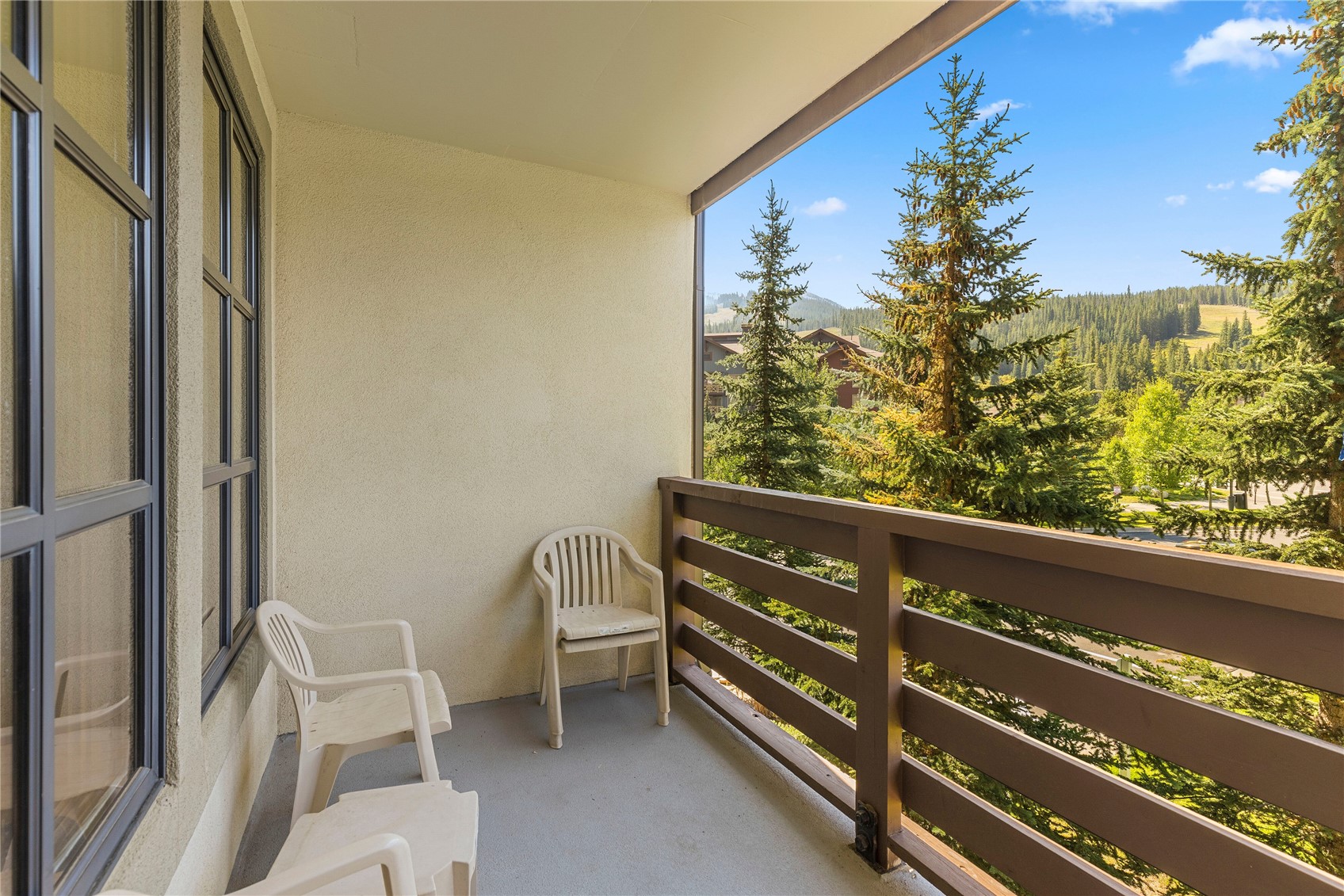 910 Copper Road, Unit 219 Copper Mountain, CO 80443 - Photo 23 of 35 a view of a chair and tables in the balcony