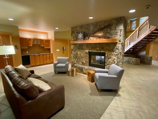 910 Copper Road, Unit 219 Copper Mountain, CO 80443 - Photo 32 of 35 a living room with furniture and a fireplace