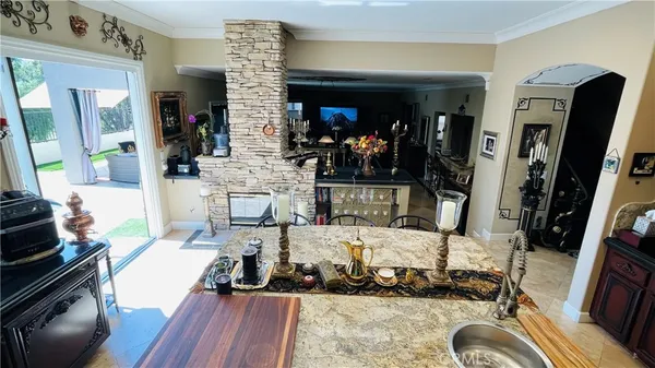 a very nice looking room with many windows and furniture