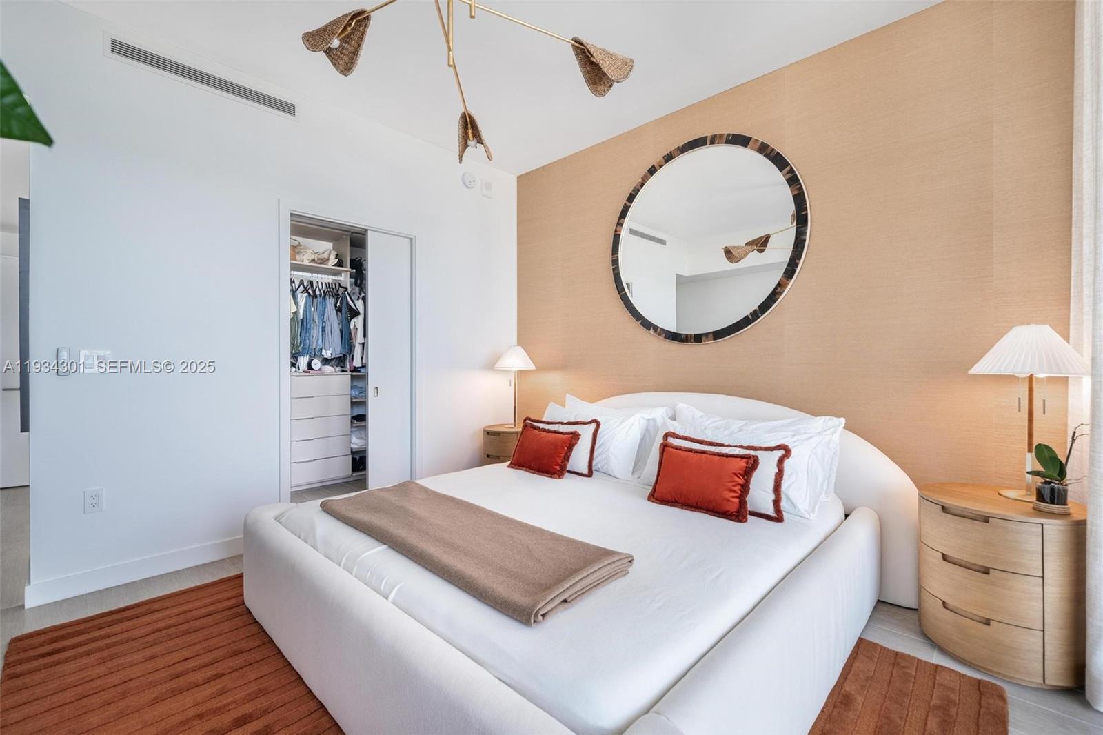 500 Alton Road, Unit 1602 Miami Beach, FL 33139 - Photo 11 of 33 a bedroom with bed and a mirror