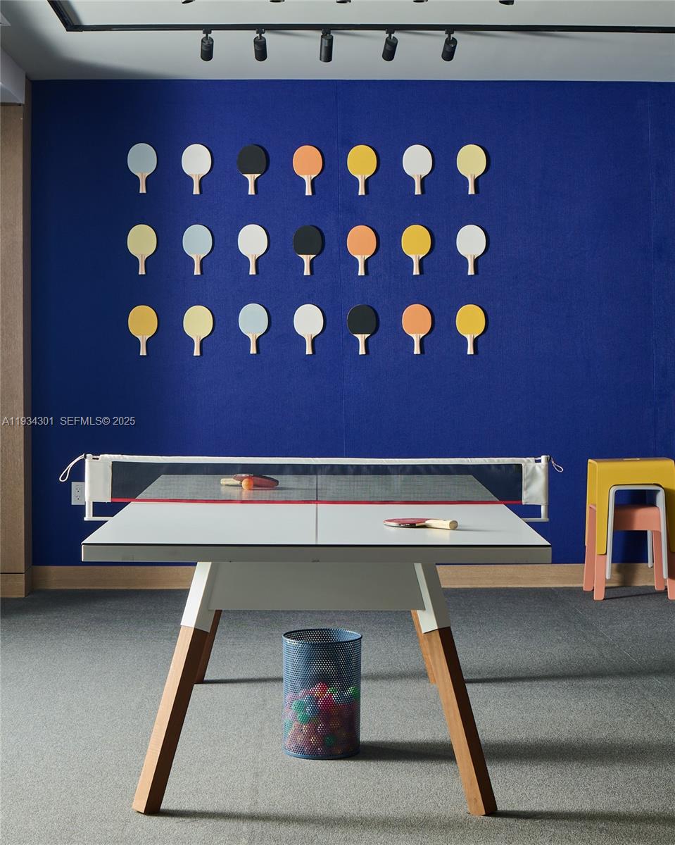 500 Alton Road, Unit 1602 Miami Beach, FL 33139 - Photo 21 of 33 a room with a table and chairs