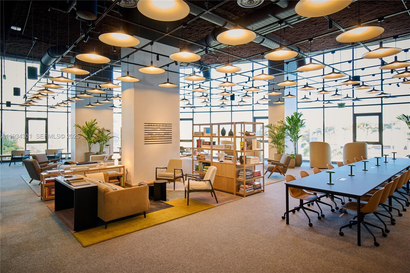 500 Alton Road, Unit 1602 Miami Beach, FL 33139 - Photo 22 of 33 a living room with patio furniture and a chandelier