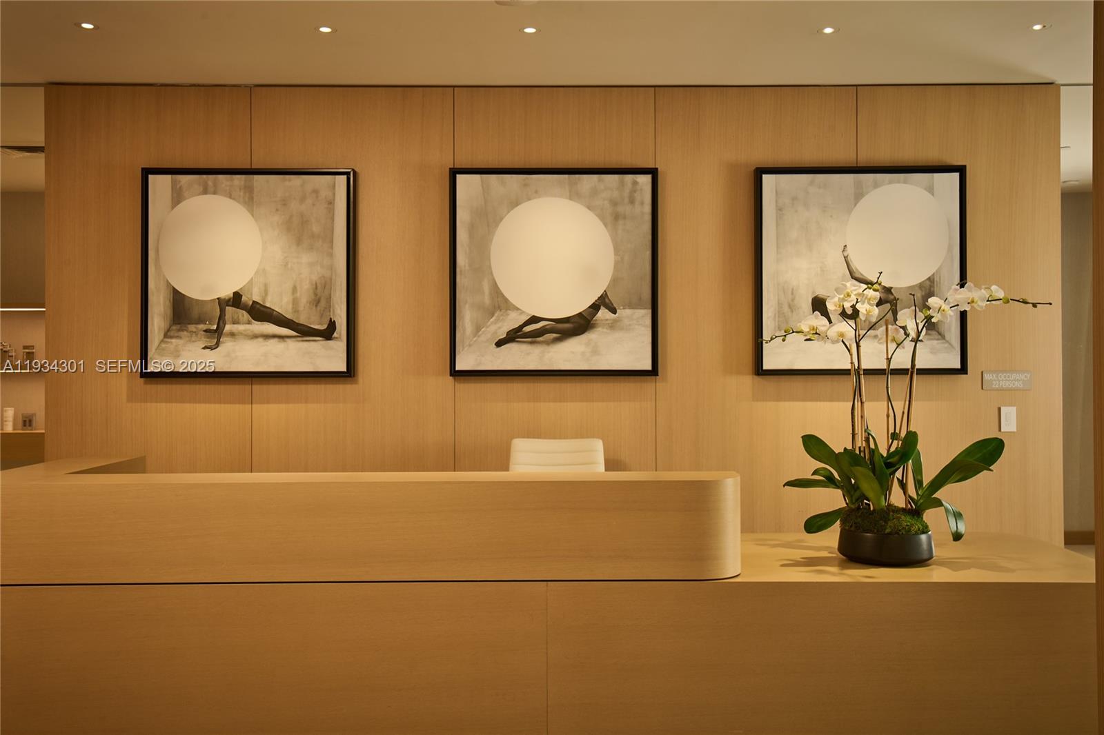 500 Alton Road, Unit 1602 Miami Beach, FL 33139 - Photo 26 of 33 a bathroom with a painting on the wall and a potted plant