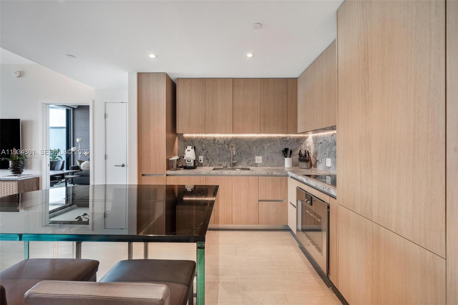 500 Alton Road, Unit 1602 Miami Beach, FL 33139 - Photo 5 of 33 a kitchen with stainless steel appliances granite countertop a stove a sink and a refrigerator