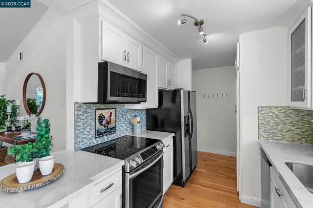 a bathroom with a sink vanity mirror and shower
